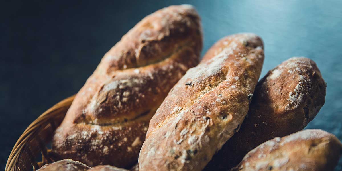 Some loaves of bread in a basket